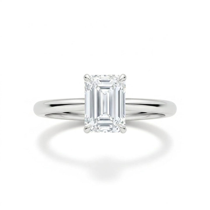 Emerald-cut solitaire engagement ring in white gold, lab-grown diamond, front view. Creation Paul H