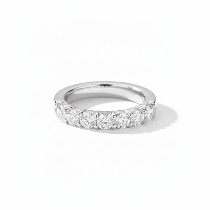 Natural diamond eternity ring, half coverage, white gold. Creation Paul H