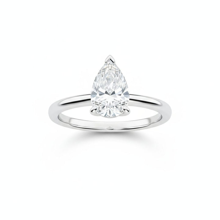 Pear solitaire engagement ring in white gold, lab-grown diamond, front view. Creation Paul H