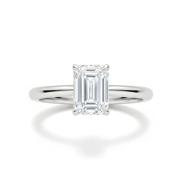 Emerald-cut solitaire engagement ring in white gold, lab-grown diamond, front view. Creation Paul H