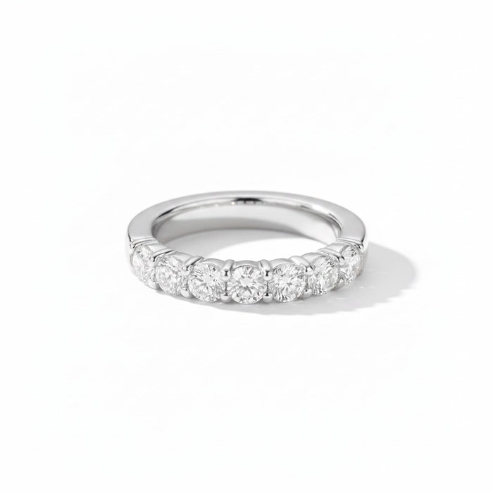 Natural diamond eternity ring, half coverage, white gold. Creation Paul H