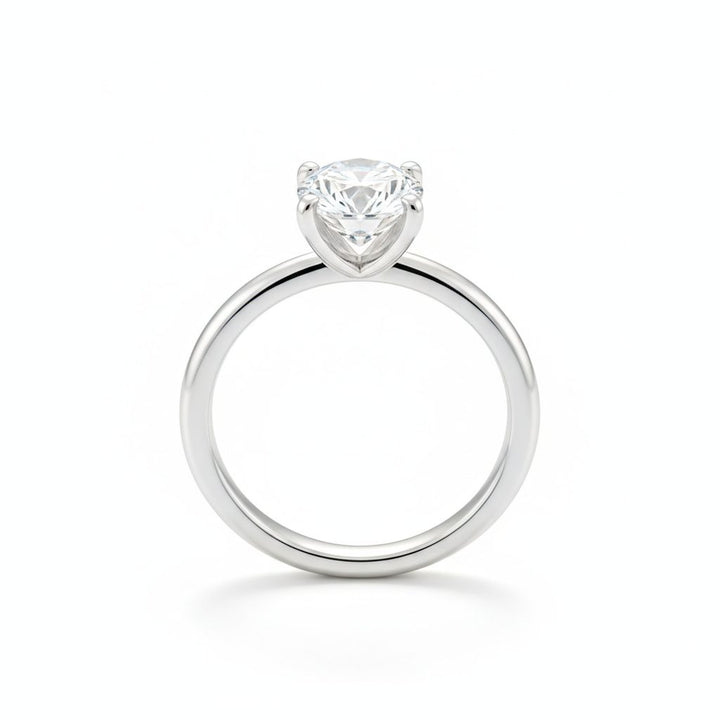 Round solitaire engagement ring in white gold, lab-grown diamond, front view. Creation Paul H