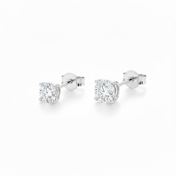 Natural diamond stud earrings, 0.50 ct pair, white gold. Creation Paul H